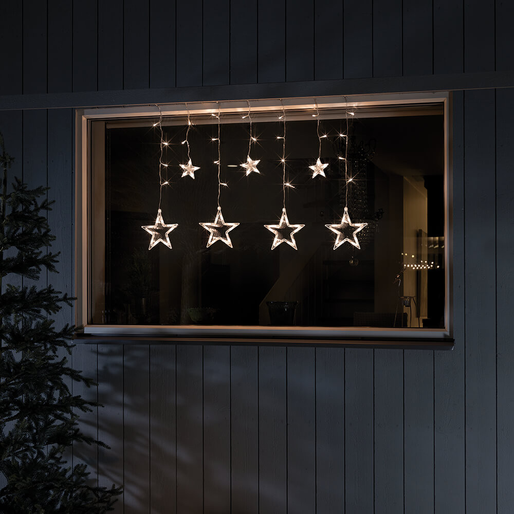 Konstsmide LED-Sternenvorhang, 72 bernsteinfarbene LED mit Solar-Batteriebox
